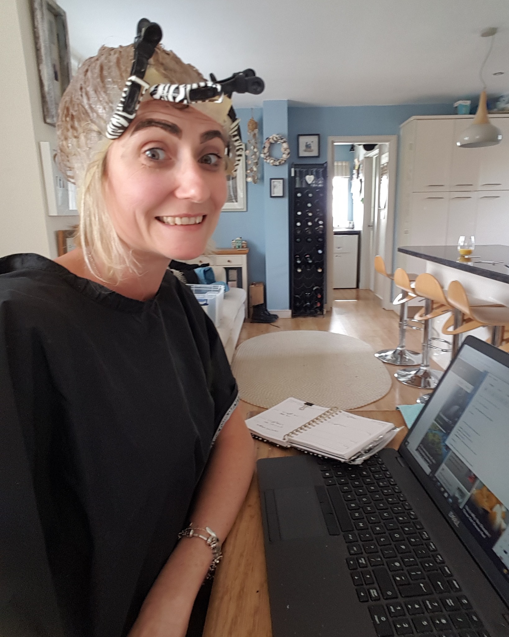 Me doing my hair whilst on the laptop, multitasking at its best.